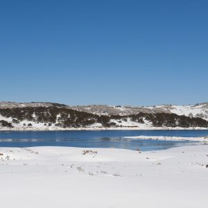 Falls Creek Rocky Valley dam covered in snow, on a beautiful winters day.
